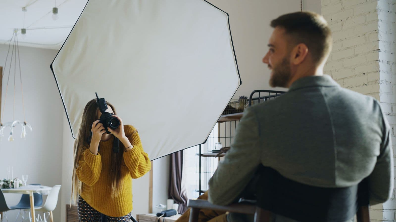 Photographer working with a client in a studio